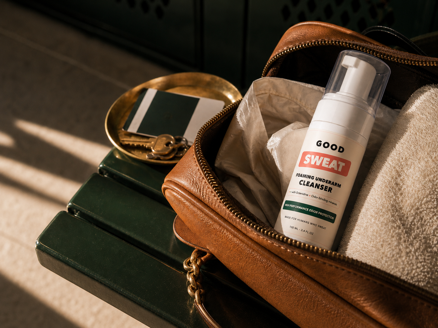 GoodSweat bottle packed with a towel and travel routine essentials.