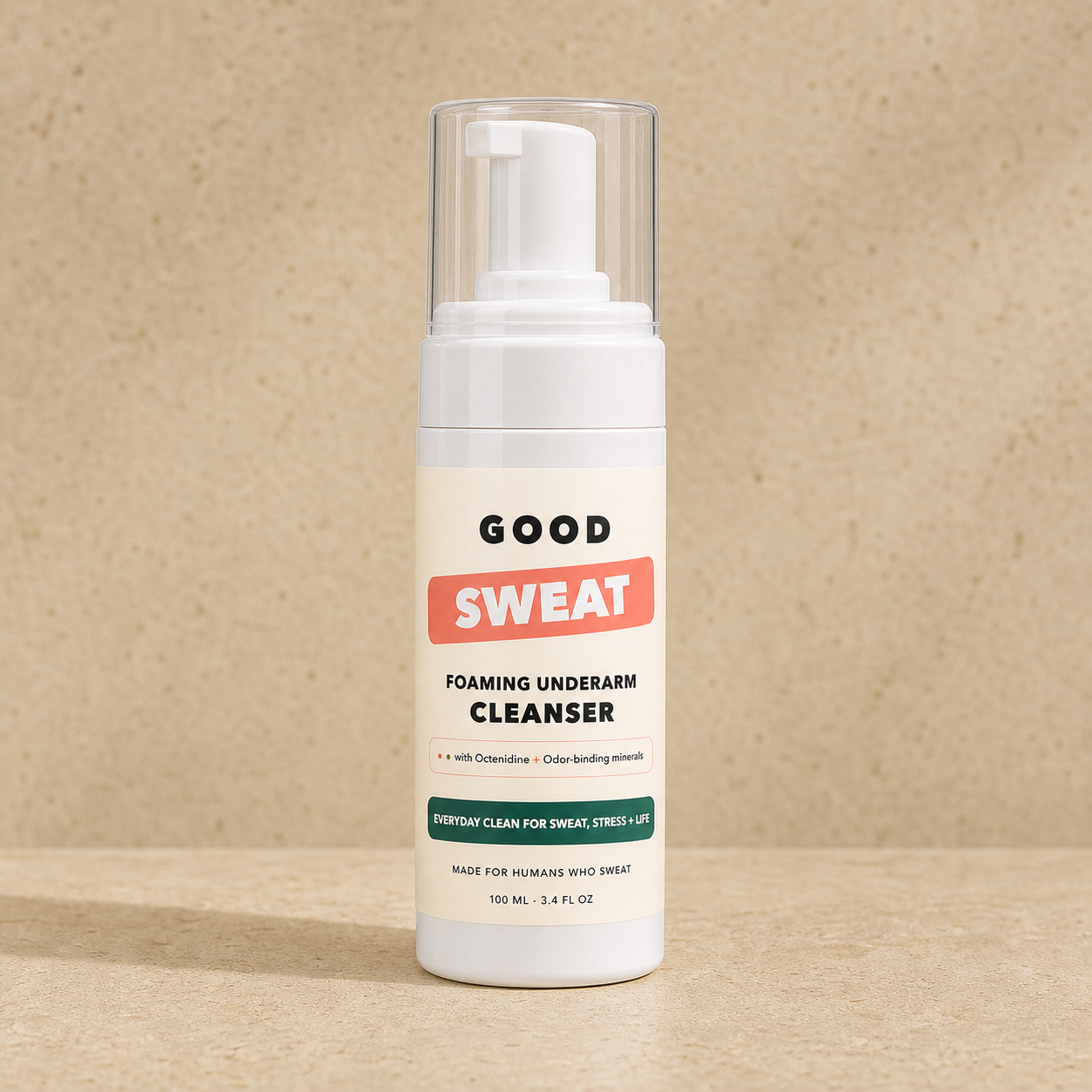GoodSweat 100ml foaming pump bottle on cream stone.